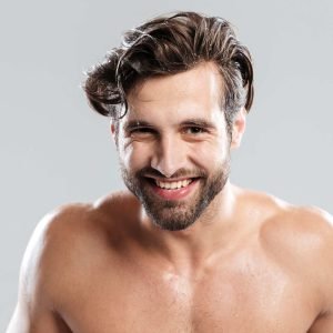 happy-man-standing-isolated-over-grey-background-P3BNTFV.jpg